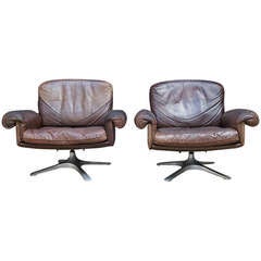 A Pair of de Sede Leather armchairs.