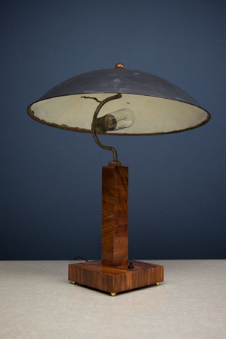 Exquisite polished timber and copper table lamp. 

Patination to the copper shade is perfect. 

Germany 1930s. 

Rewired and Pat tested. 

H:53 W:42 D: 42 CM
