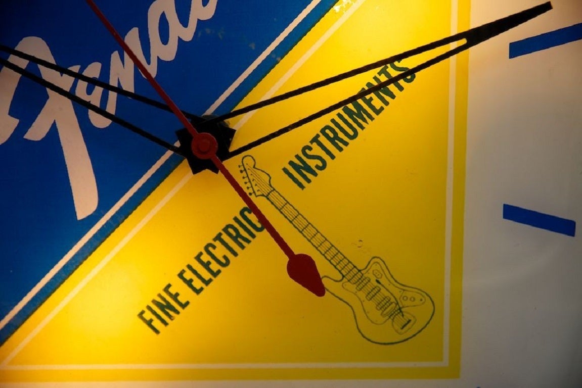 A Fender Guitars Illuminated dealer wall clock. 

Manufactured in 1963 by the Pam clock company of New Rochelle, New York. 

Found in almost as new condition in a Liverpool music shop. 

Rewired and PAT tested. 

H:40 W:40 D:40 CM.
