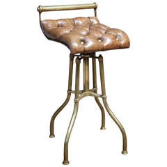 Brass and leather music stool