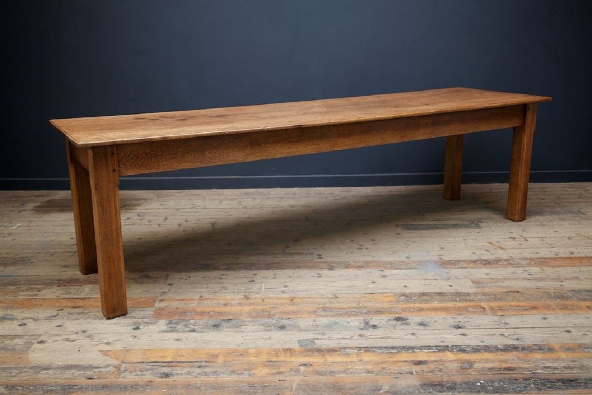 A oak refectory dining or kitchen table. 

Square stop chamfered legs, simple stretcher, one with small period repair, three plank top. 

Good colour, beautifully constructed. 

English mid 1870s. 

Height: 78 cm Width: 275 cm Depth: 77 cm