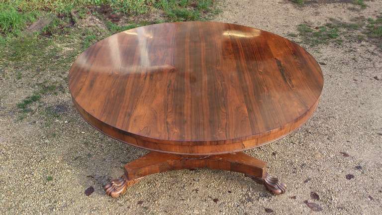 Antique rosewood circular dining table. 

We think that rose wood is one of the most beautiful timbers for an antique dining table. It is slow growing, extremely expensive, very hard and durable, and it is virtually impossible to find in large
