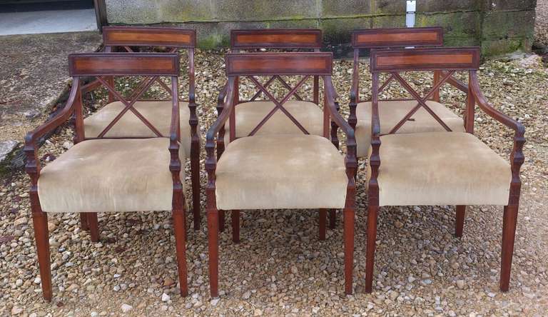 Very unusual set of 7 dining chairs, all with arms! 

They are from the reign of George III and true to the period they are extremely well made. They are made of good solid mahogany, they have tenon joints, correct corner stretchers and precise