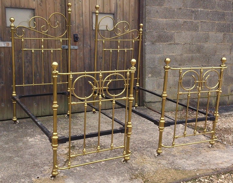 Antique Symmetrical Iron Frame Brass Beds at 1stdibs