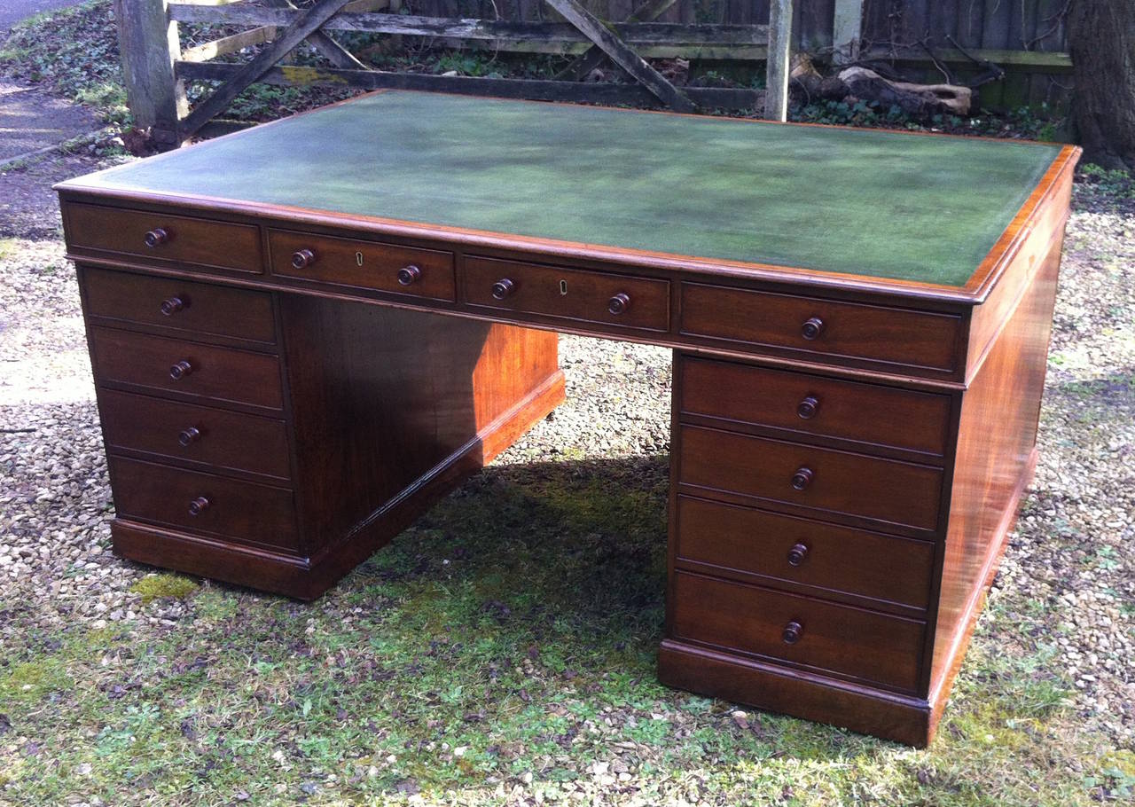 Big early C19th mahogany antique partners desk with drawers both sides of the top, the pedestals with drawers one side and cupboards the other. The mahogany is a good deep colour which has attained a fine patination over its two hundred years.
