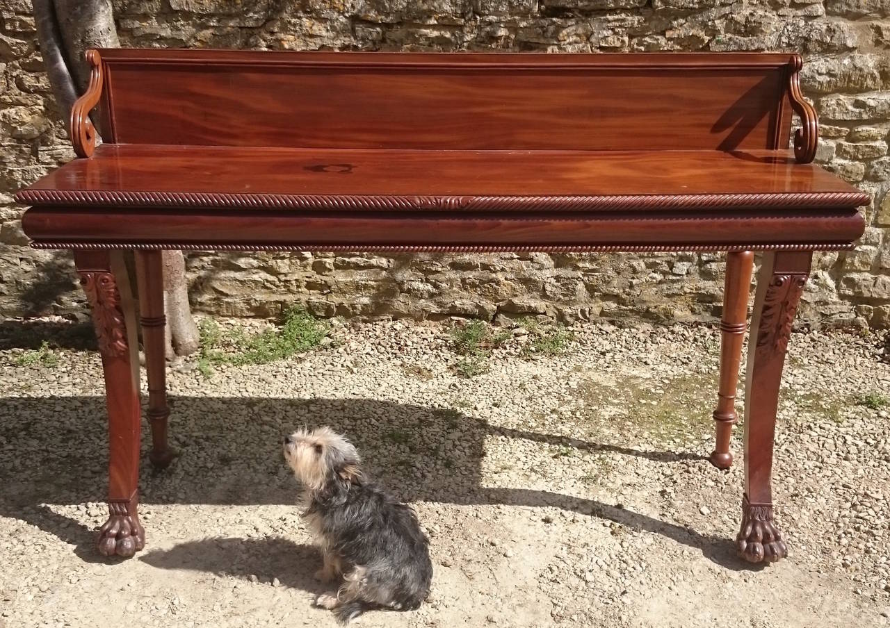 Antique serving table made of particularly fine mahogany. This is a very striking and elegant piece when viewed first hand. 

English or Irish circa 1830 

75