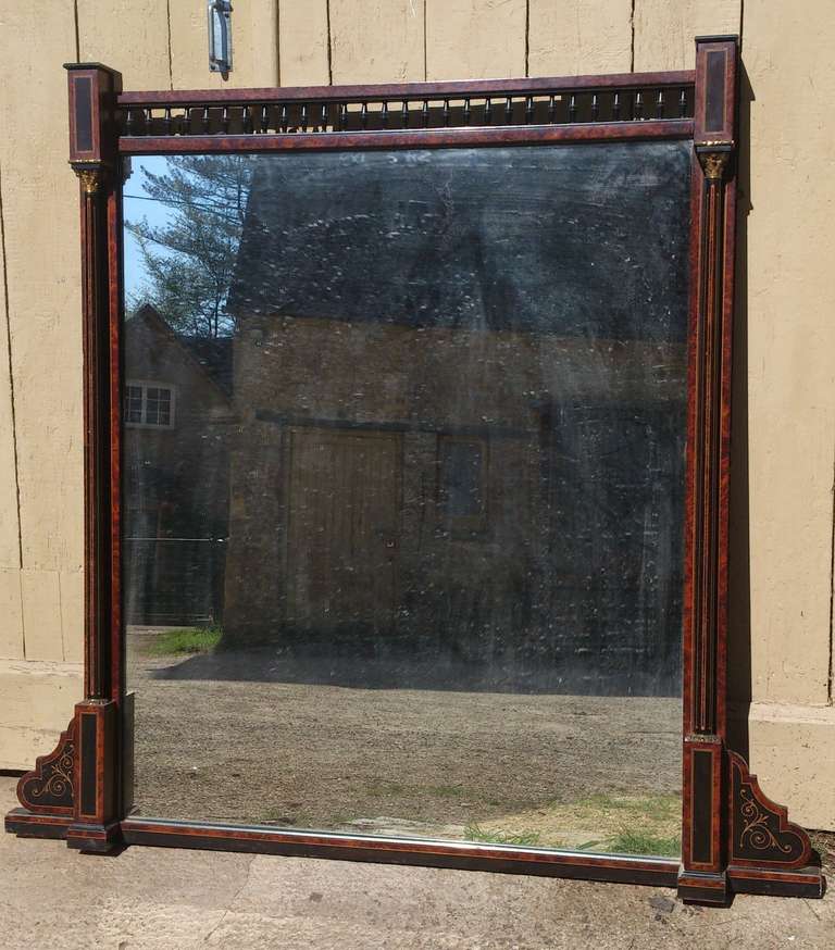 Very fine quality 19th century ebonized and amboyna wood overmantel mirror, with proper panelled back, brass beading to the lower edge and pillars on the front. Amboyna is a fine and close grained exotic hardwood with small swirls in the surface. As