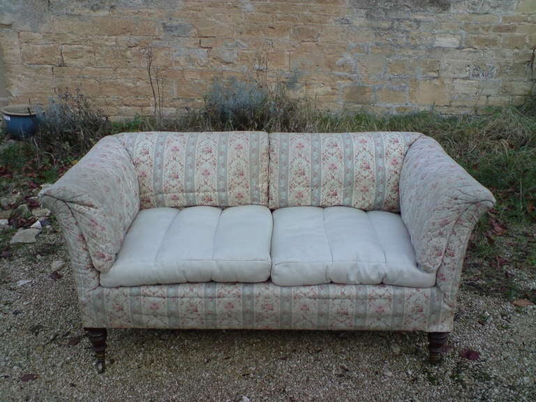 Howard and Sons sofa, a Baring model of unusually small proportions which still has the sprung and seige de duvet upholstery of its larger siblings. Please note that this is a library photo of one that we had last year, the one in question is