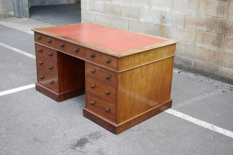 Very fine quality early 19th century mahogany antique partners desk. This desk has drawers one side of the pedestals and cupboards the other the top has drawers both sides. This desk is made of interesting cut of mahogany with fine faded patina. The