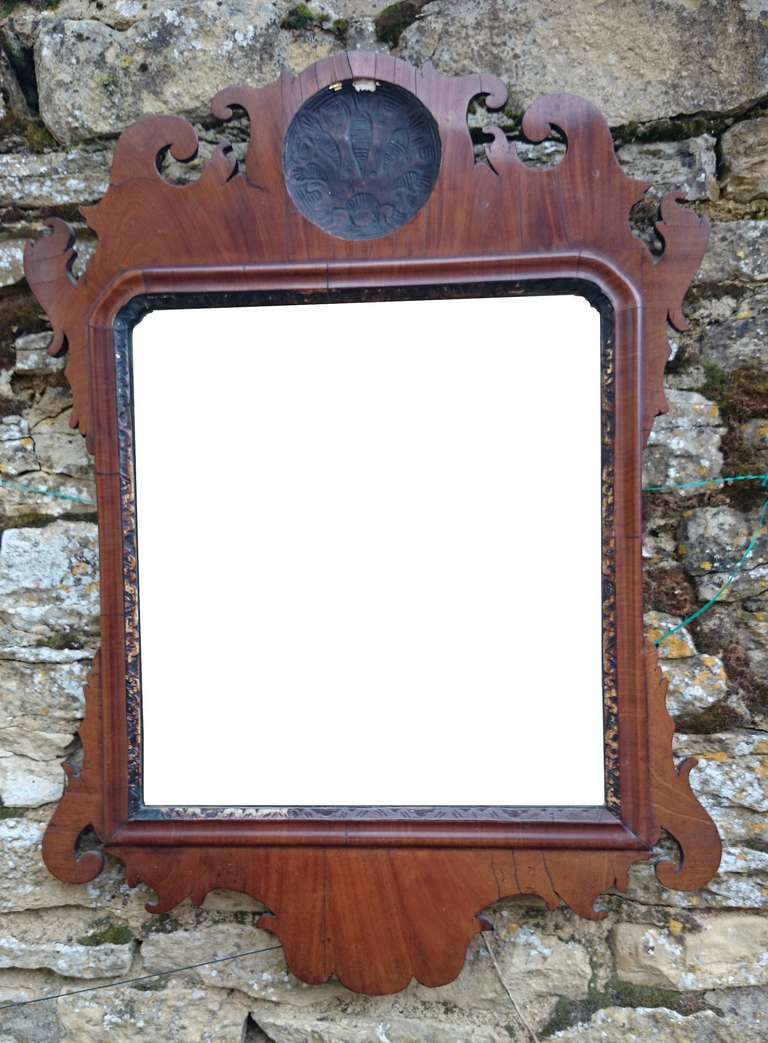 George III revival antique mirror made of book matched mahogany with traces of the original gliding round the old glass.

English circa 1880

20