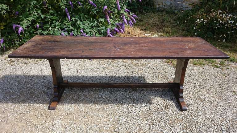 Antique refectory table made of single lengths of oak. This table has attained a good deep colour in its relatively short life and, unlike the earlier versions, this one has the stretcher safely out of the way so to preserve maximum space for the