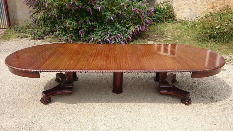 Unusual and very versatile antique dining table made by Paine's Furniture Company of Boston Massachusetts, USA. 
Paine's were the largest furniture manufacturer in Massachusetts for a long time. 
This table extends to 12 feet long and reduces to