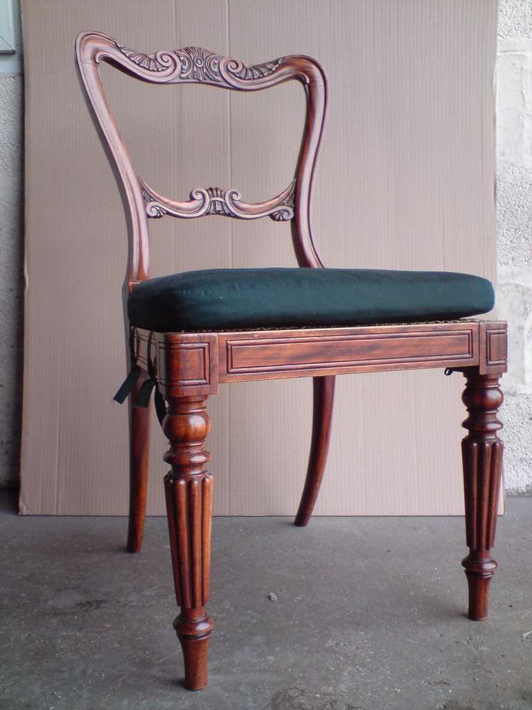Exceptionally fine set of antique dining chairs made by Gillow, the best furniture maker of the 18th and 19th century, these chairs follow the classic Gillow form with wonderful crisp carving to the back and standing on tall slender reeded legs