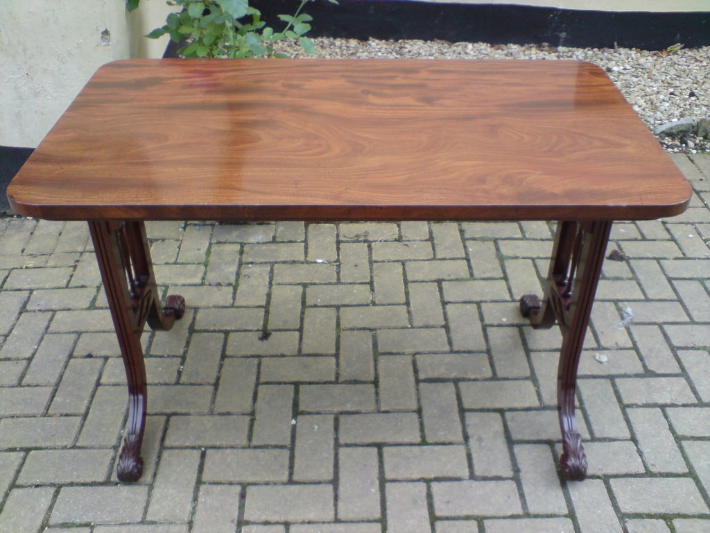 Really fine quality Regency mahogany library writing table made of most wonderful dense grained and figured mahogany, this table stands on very well drawn end supports that finish by sweeping parallel to the ground, all the details are precisely