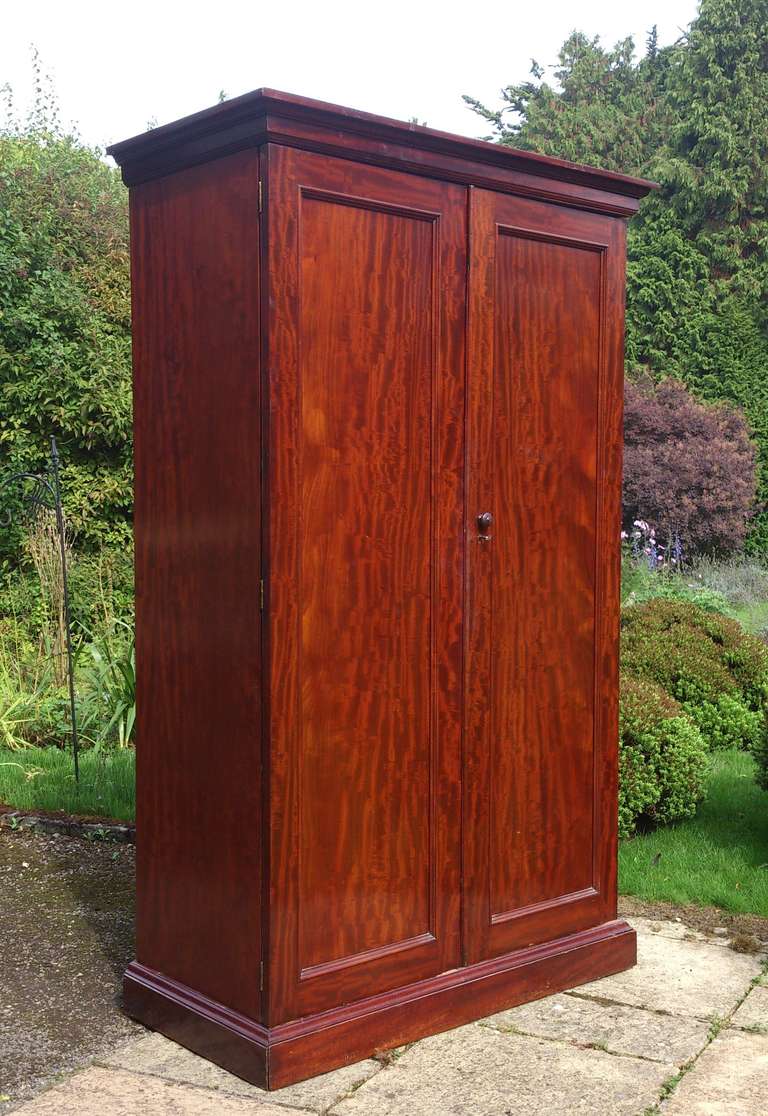 Mahogany wardrobe with a lovely grain pattern and really well made from huge sheets of the finest Cuban mahogany. English circa 1840-1860 

85 1/2