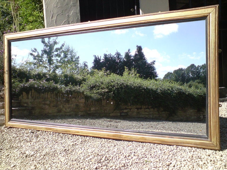 Unusually vast antique mirror with lovely ebonised reeded border, can be hung portrait or landscape. English circa 1840