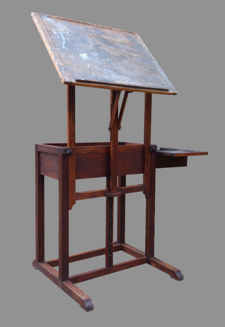 Useful table / desk / easel with drawer with sliding lid and fully adjustable painting stand. The table rotates though 360 degrees, it tilts through any angle through 90 degrees to be anywhere from fully upright to fully horizontal. With overlong