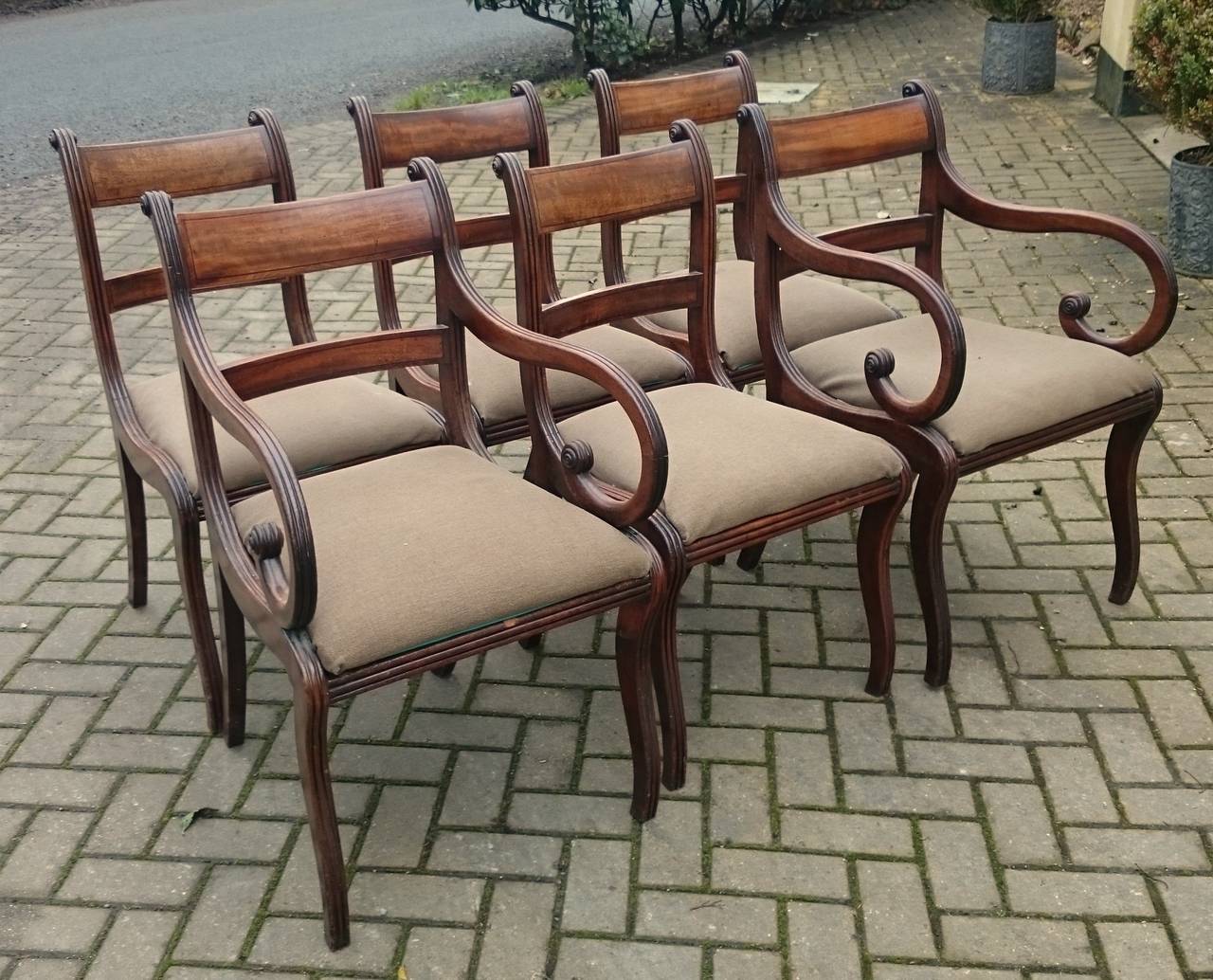 Really exceptional quality set of six antique dining chairs made of solid Cuban mahogany. They are an unusually generous shape with flowing lines from the back rail to the front leg which mean that there are almost no straight lines on the whole