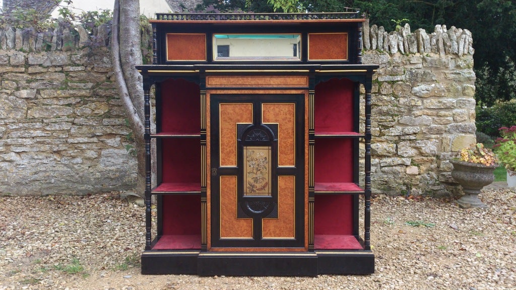 Arts & Crafts cabinet made my Marsh Jones and Cribb, this cabinet is extraordinarily well made and uses some of the finest timber we have seen in a piece from this period. It is ebonized with solid ebony sections and has panels made of pure burr
