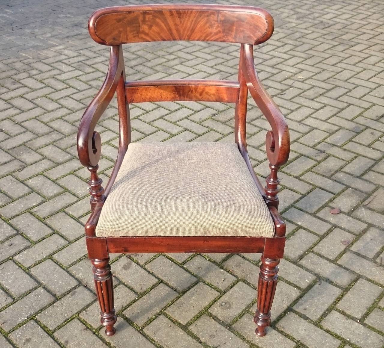 Antique dining chair, good size and comfortable, good shape to the arms and standing on fine reeded legs. 

English circa 1830
