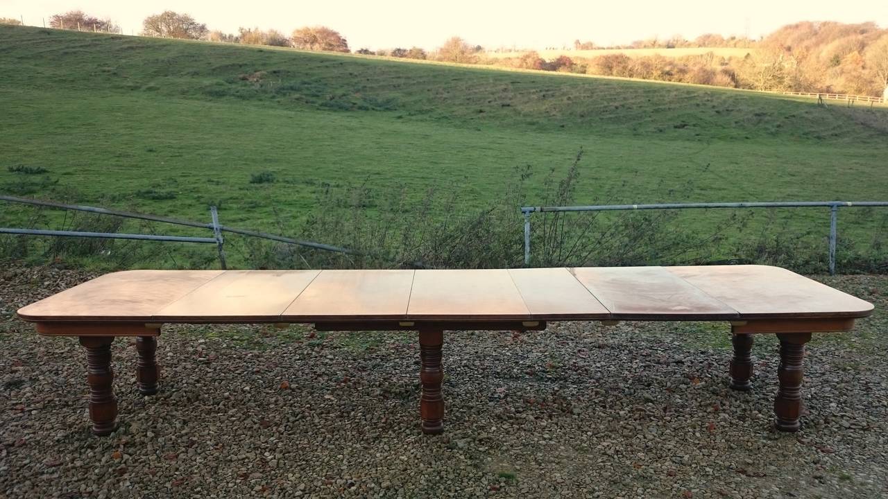 Antique dining table made of satin birch. This is a wonderful timber which catches the light beautifully to give the impression of being three dimensional. It is reminiscent of floating satin, which might be where it gets its name. 
This antique