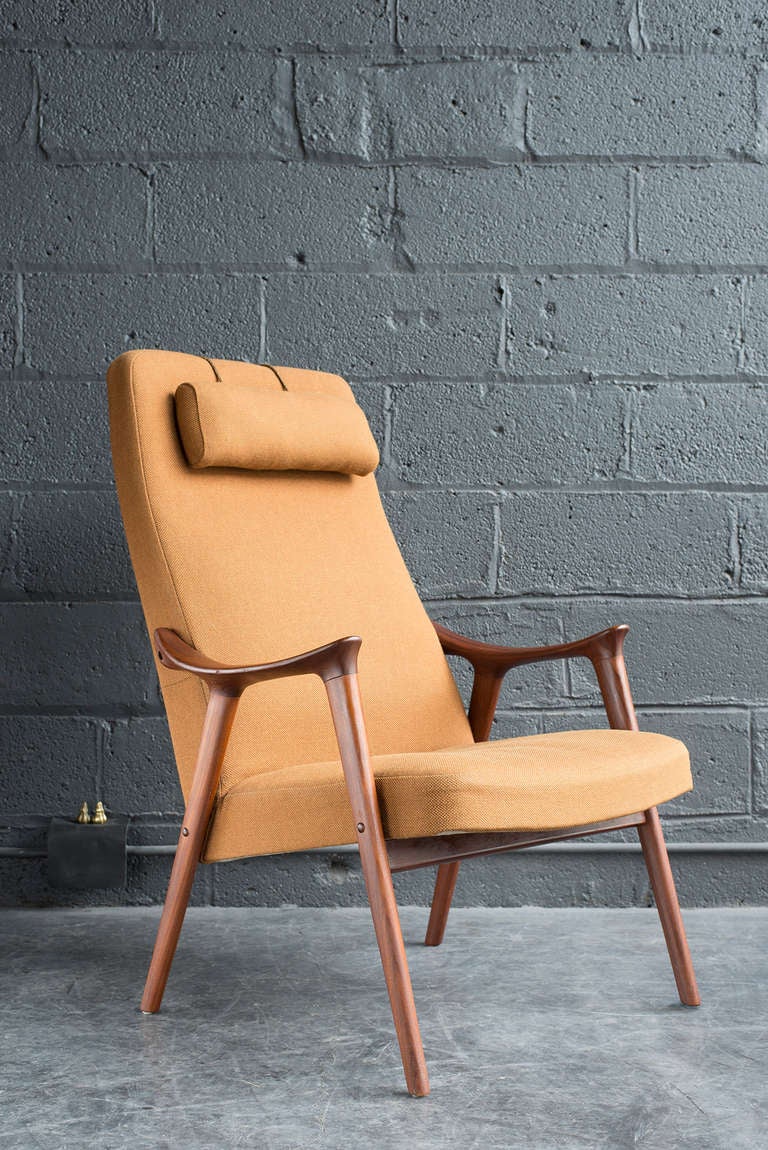 Sculptural, solid teak frame. Original wool fabric in fine, clean condition. Spring cushions. Westnofa sticker underneath.