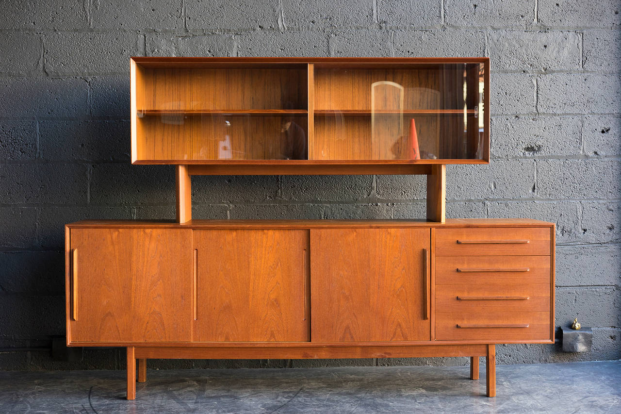 Lovely teak construction. Fine condition. The hutch rests upon the sideboard. By Falster.