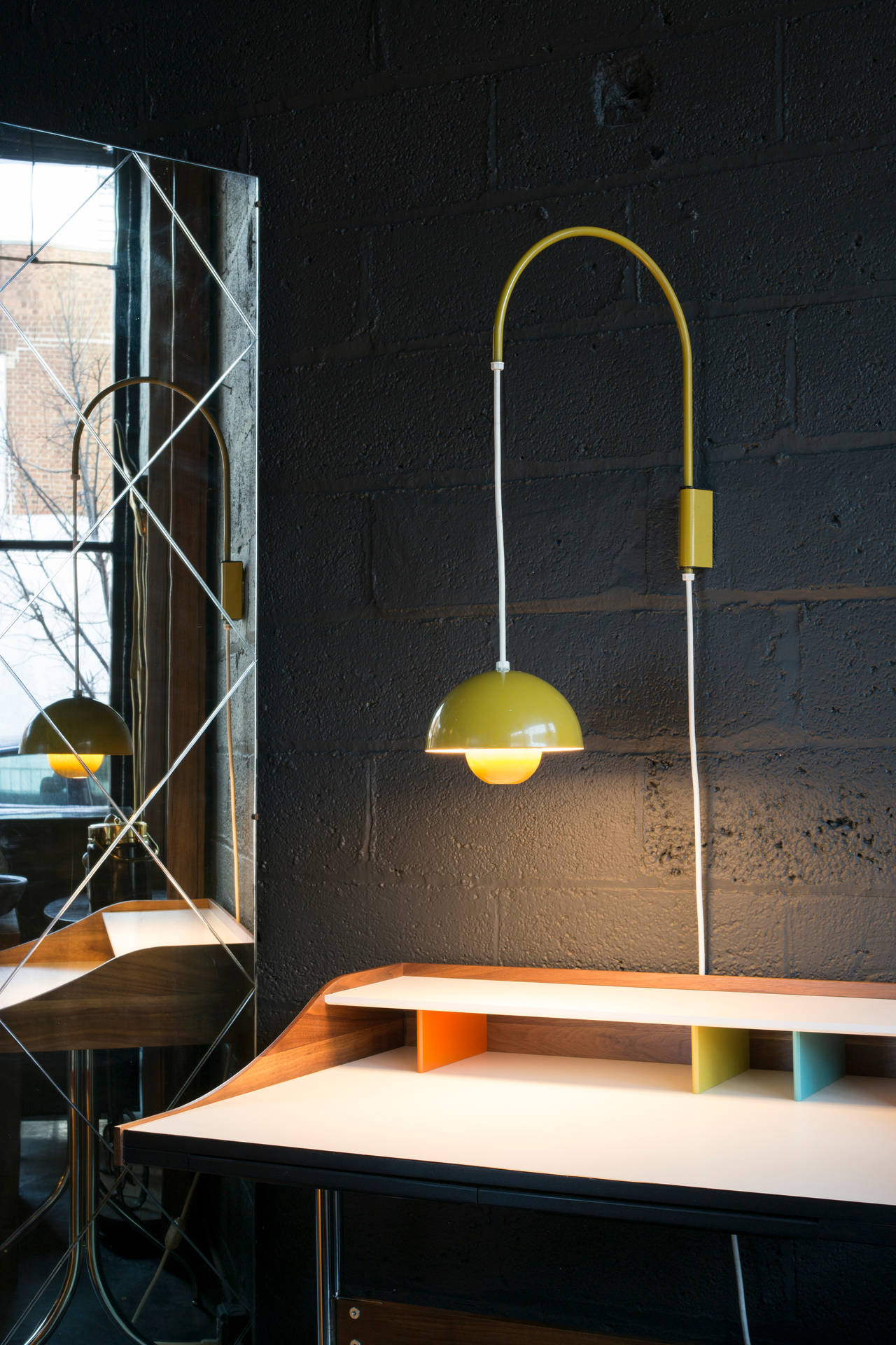 White cord can be extended or retracted to raise or lower light. U-shaped arm swings left and right. Original yellow finish. Creates a soft, diffused, pleasant light.