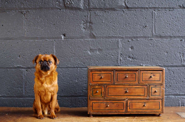 Charming Italian chest of eight drawers with nice patina, dovetail construction, & inlaid geometric decoration.