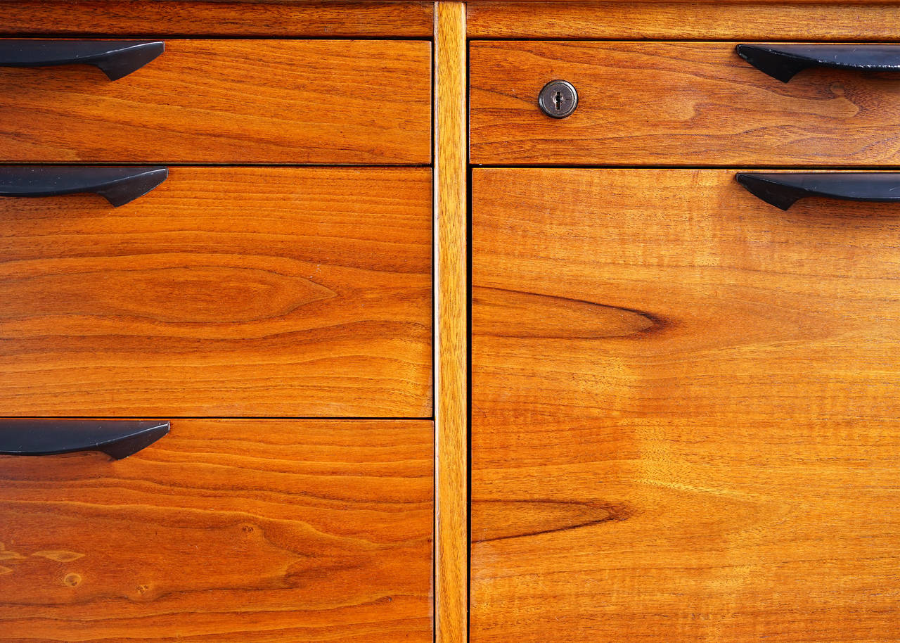 Bookmatched walnut construction with rich warm tone and figured grain. Five drawers, including one hanging file, plus one cabinet. Handsome and functional.