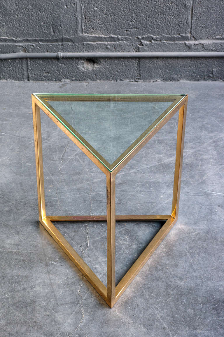 Brass plated geometric form with inset glass top.