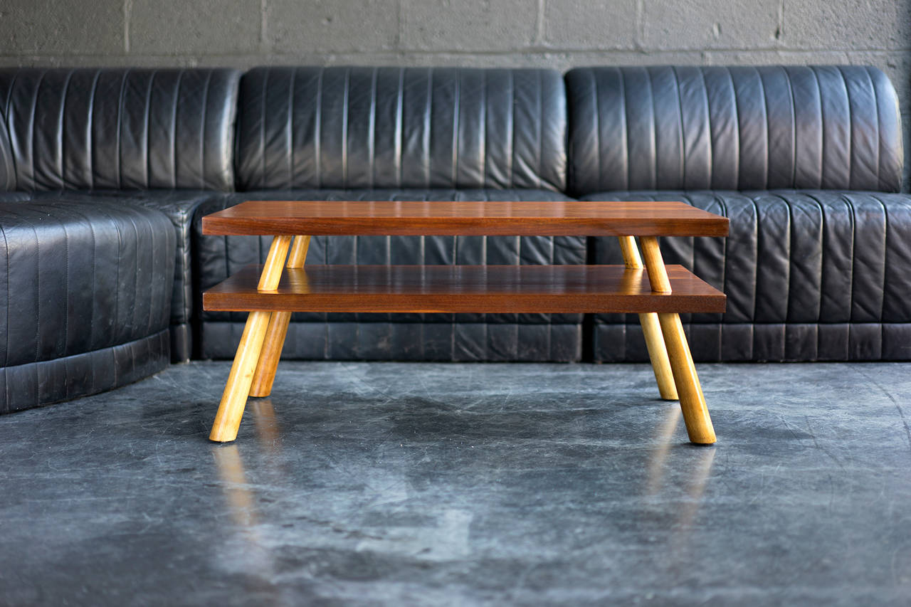 Two-tier walnut coffee table
manufactured by Widdicomb.