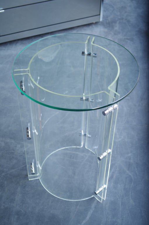 lucite base with polished steel hardware, pencil polish glass top