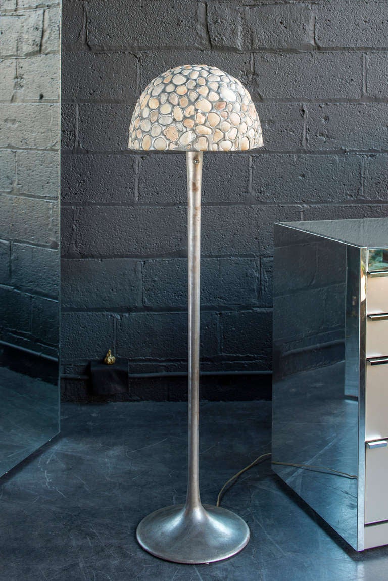 unusual lamp with a shade of whole, translucent stones set in metal

steel, tulip base with 3-way switch & porcelain socket

table lamp version also available