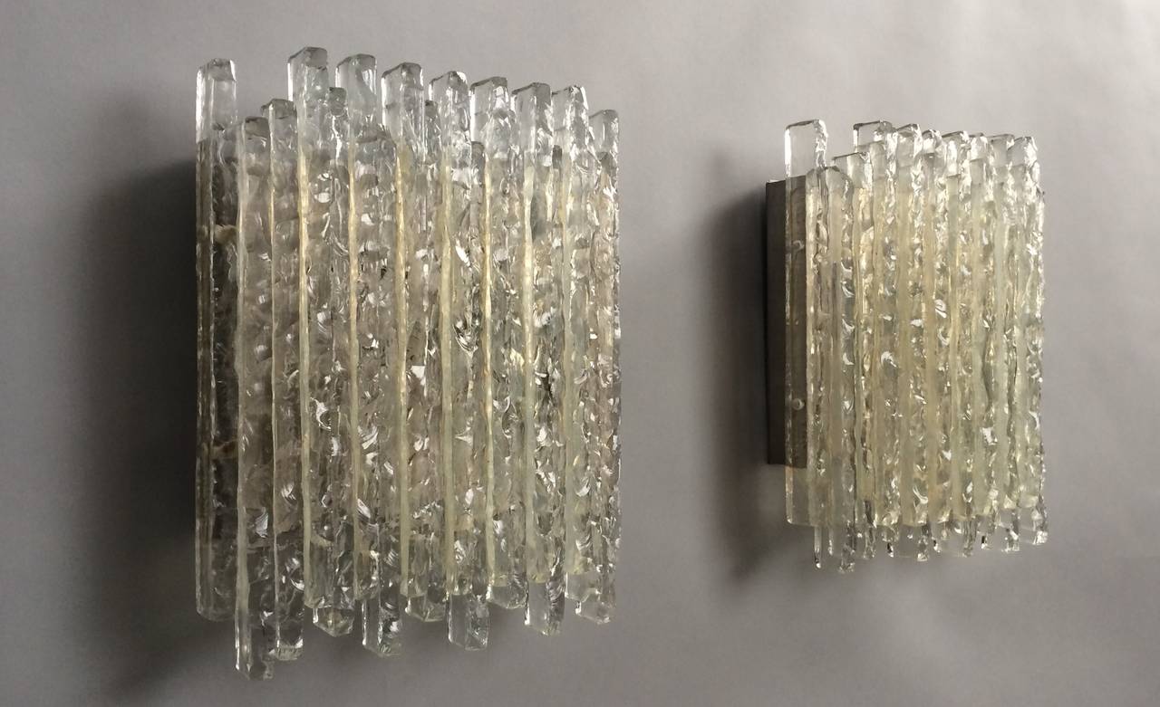 Sconces made in chiseled raw crystal with metal electrical plates. Two electrical sockets per sconces.