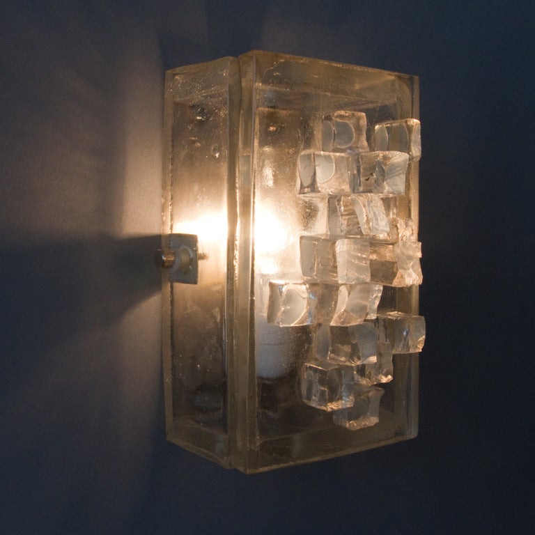 A single rectangular raw crystal sconce.