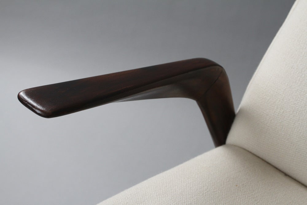 elegant armchair with nicely sculpted arms.