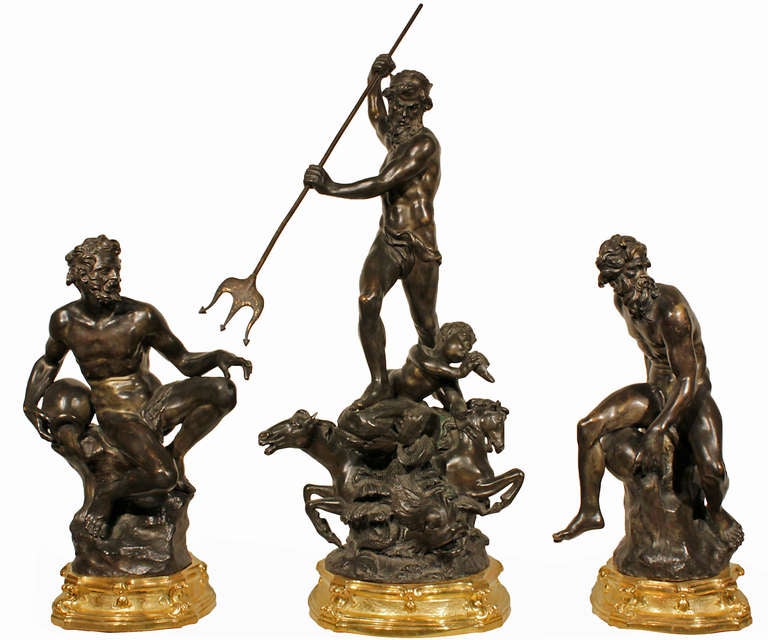 A stunning set of three very decorative Italian 19th century patinated Bronzes.  Each bronze is raised by a richly chased satin and burnished ormolu square base with convex sides. The center statuary has two prancing horses flanking a dolphin. Above