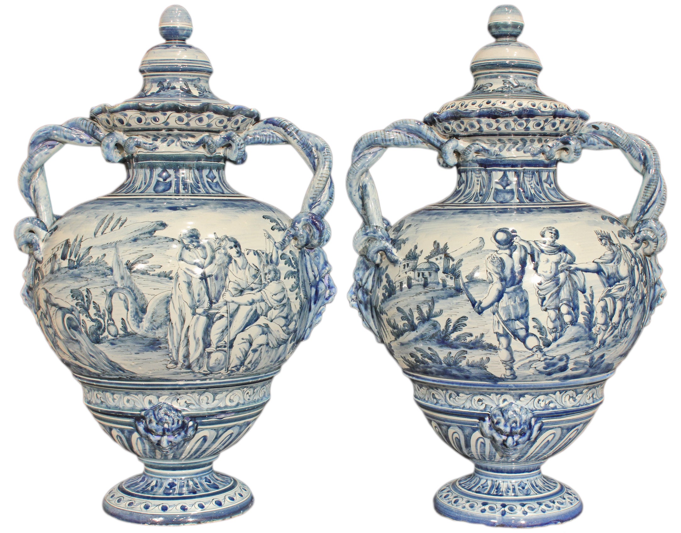 A pair of early 19th century Italian blue and white Majolica lidded urns