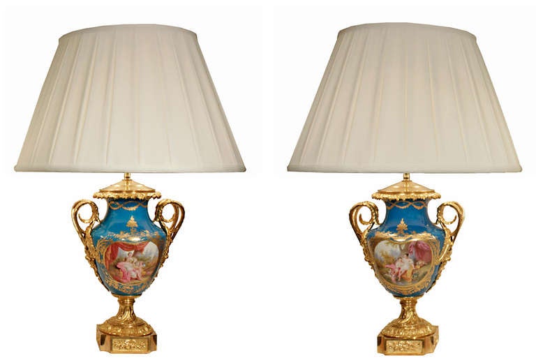A Pair of French Louis XVI St. Sévres Porcelain and Ormolu Urns Mounted into Lamps