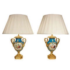 A Pair of French Louis XVI St. Sévres Porcelain and Ormolu Urns Mounted into Lamps