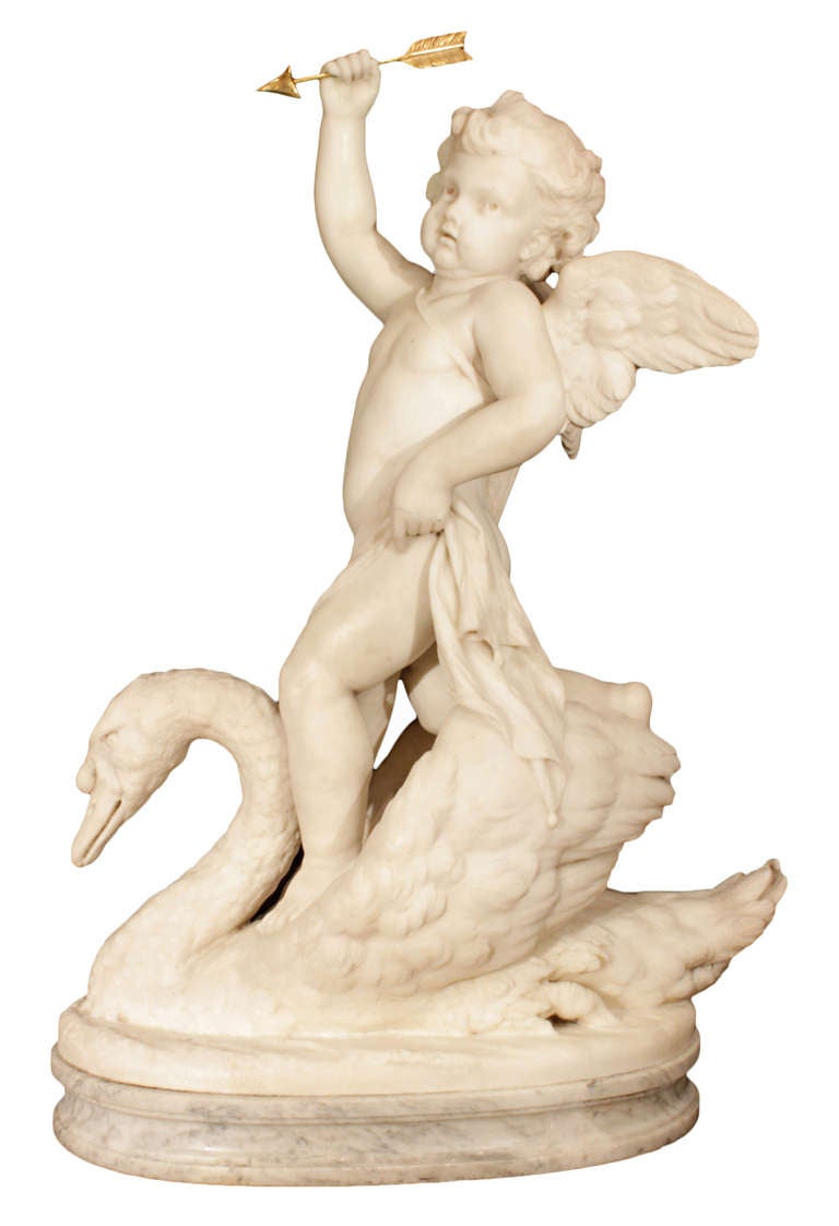 A charming and extremely well executed 19th century Italian marble sculpture signed Guisepe Carnevale, Roma 1886. The statue is raised by an oval mottled base below a charming cherub riding on a swan. The cherub is holding a draped cloth with an