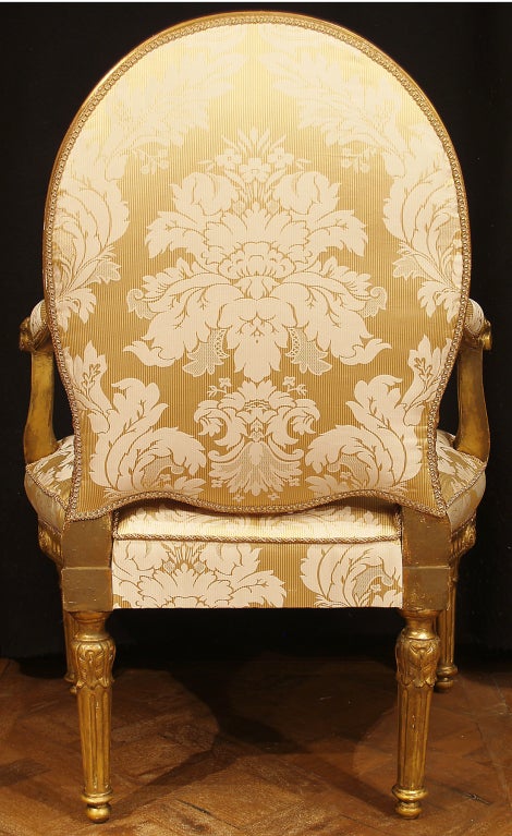 A pair of Italian Louis XVI st. giltwood armchairs 1