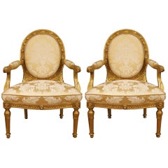 A pair of Italian Louis XVI st. giltwood armchairs