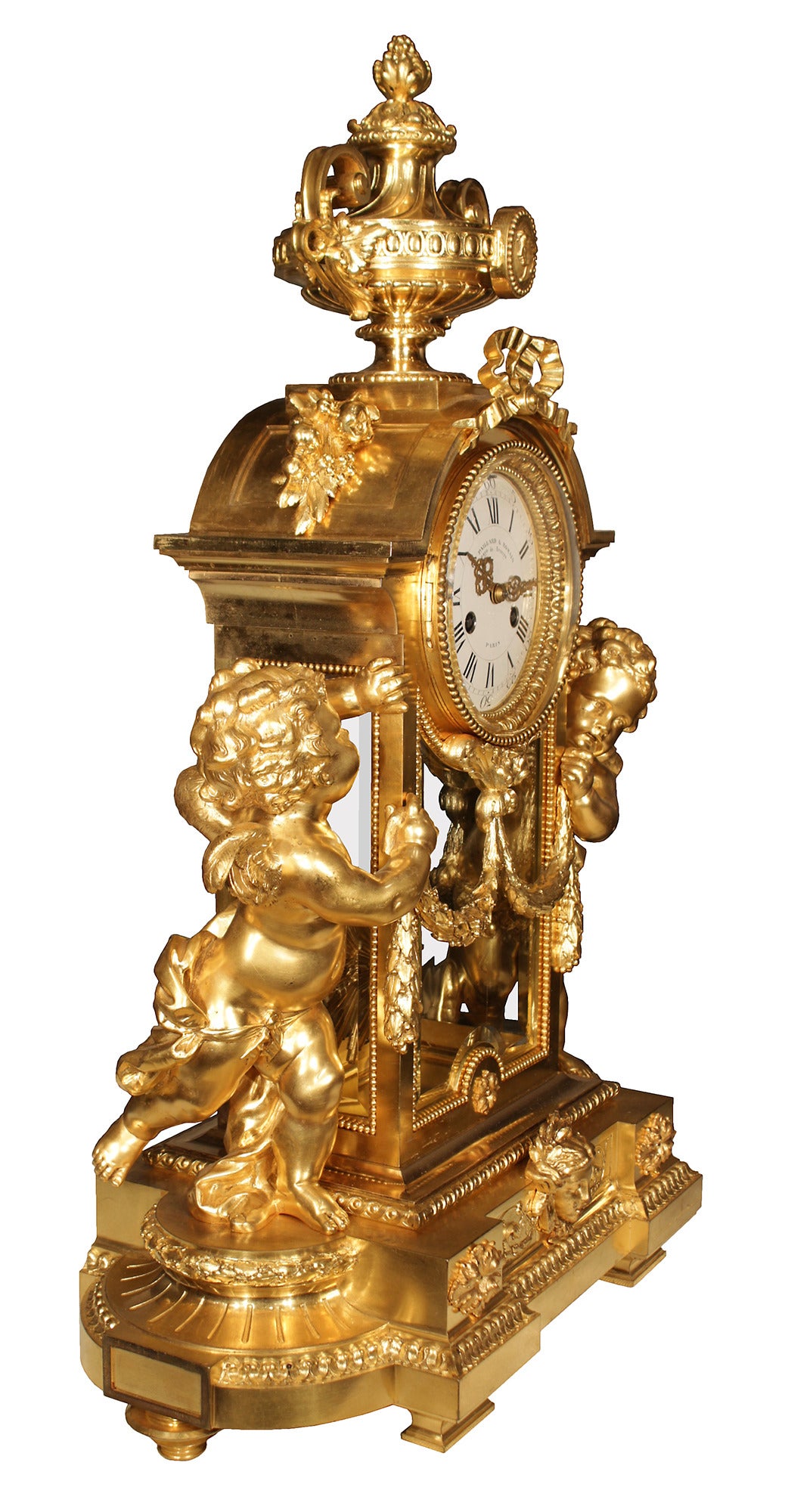 An exquisite and high quality French 19th Louis XVI style ormolu clock by Victor Paillard and Romain, fabricants de bronzes, Paris. The clock is raised on rectangular feet below an oval ormolu base decorated with a central female mask among beaded