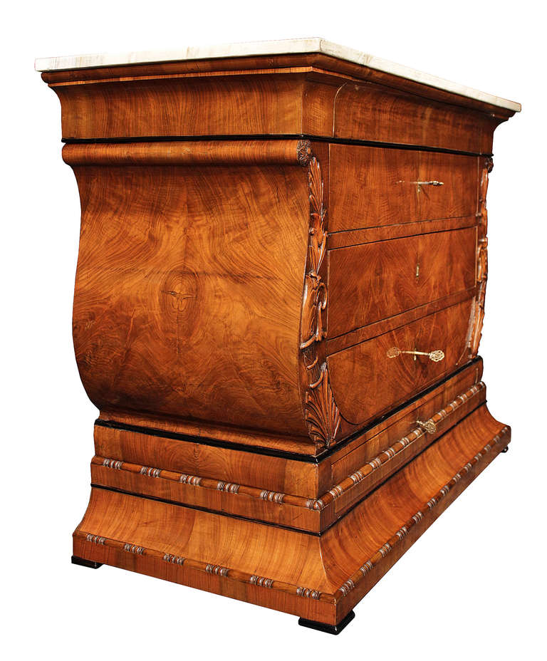 A handsome Italian 19th century Neo-Classical st. five drawer walnut chest from Turin. Raised on a tapered base with attractive reeded carving borders. Above are the five drawers four of which have ormolu keyhole escutcheons. The elegant lyre shaped