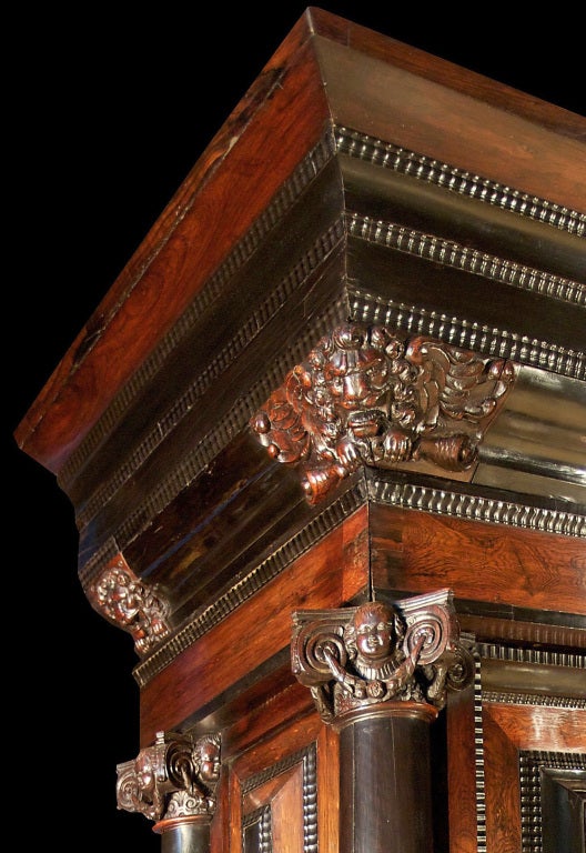 A monumental mid 18th century Dutch ‘Meubles à Coussins’ ebony and rosewood Kussenkast. This most impressive cabinet is raised by bun feet below the dentil shaped frieze with a wide drawer and original iron pulls. The raised double paneled doors and