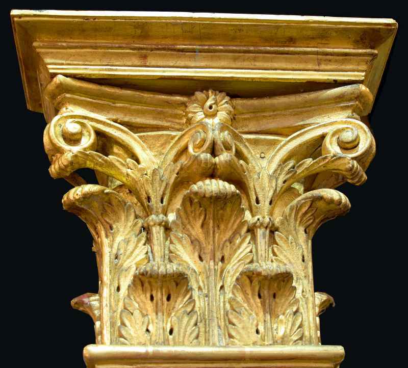 An impressive set of four French mid 19th century Louis XVI st. giltwood and plaster fluted columns. Each column has a moulded base and flutes all the way to the top. Finished by a richly carved pierced gilded capital with acanthus leaves. Wonderful