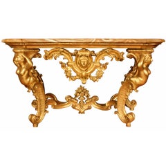 A  Italian 18th century Louis XV period freestanding Genovese giltwood console