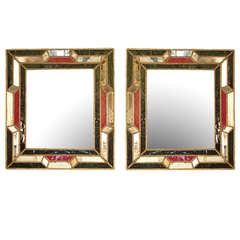 A pair of early 19th century Italian mirrors with red and dark blue glass